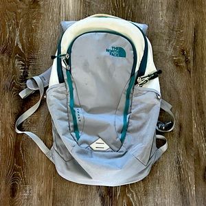 Grey and White North Face Backpack
